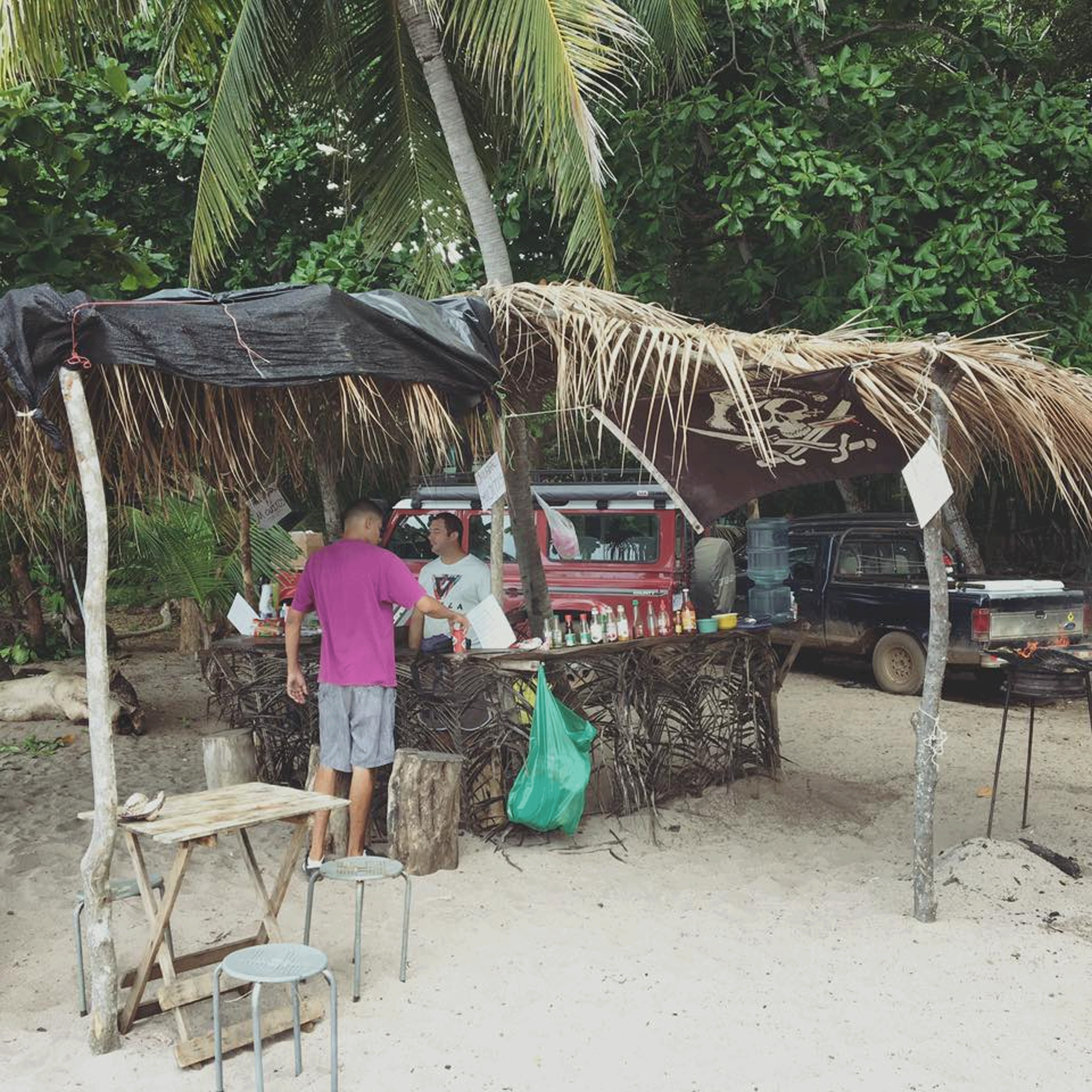 Costa Rica beach taco and beer tiki hut near Tamarindo Playa Flamingo Playa Honda Land Cruister Defender Ford Ranger Pirate Flag