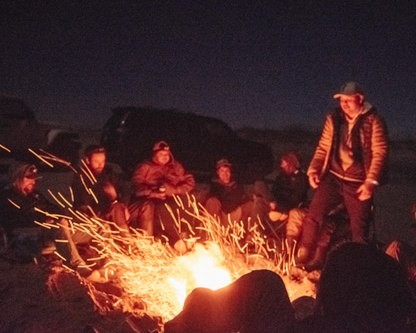 Bonfire on the beach with lot of friends and music